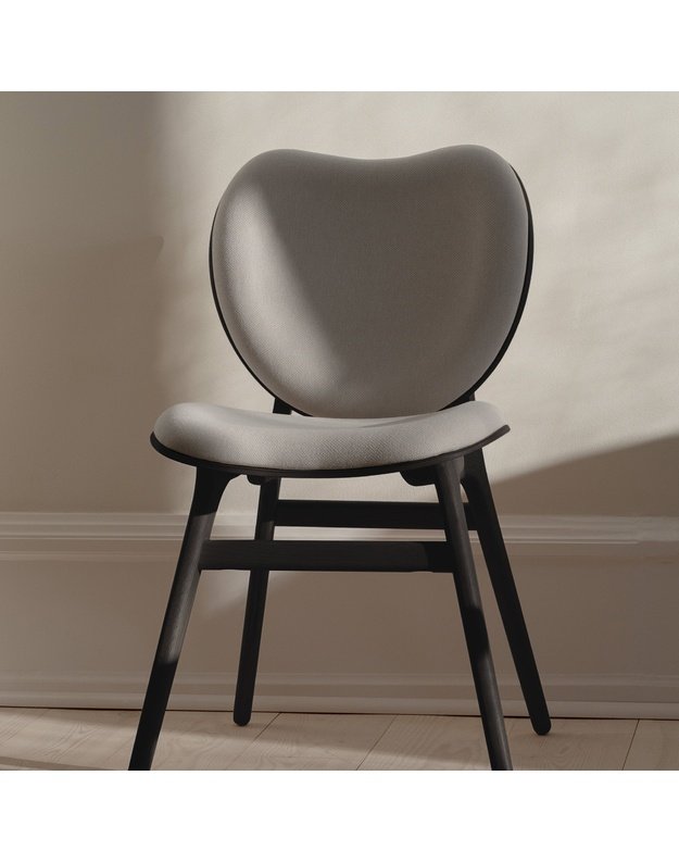 A CONVERSATION PIECE DINING CHAIR | Black Oak