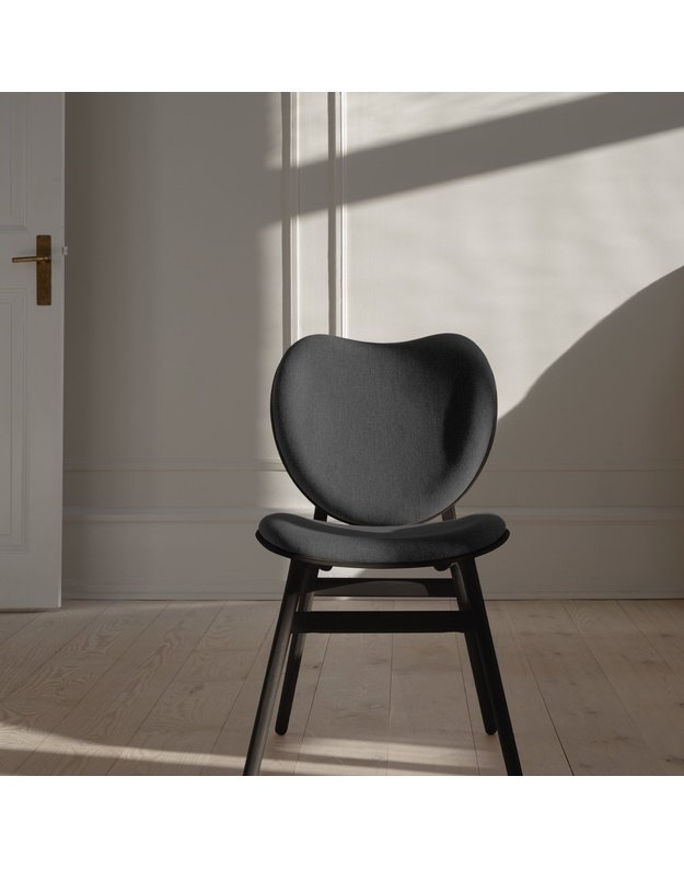 A CONVERSATION PIECE DINING CHAIR | Black Oak