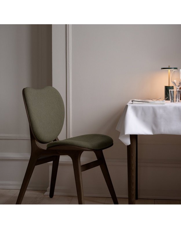 A CONVERSATION PIECE DINING CHAIR | Walnut