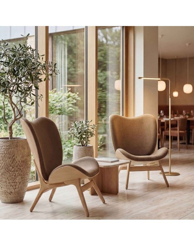 A CONVERSATION PIECE TALL LOUNGE CHAIR
